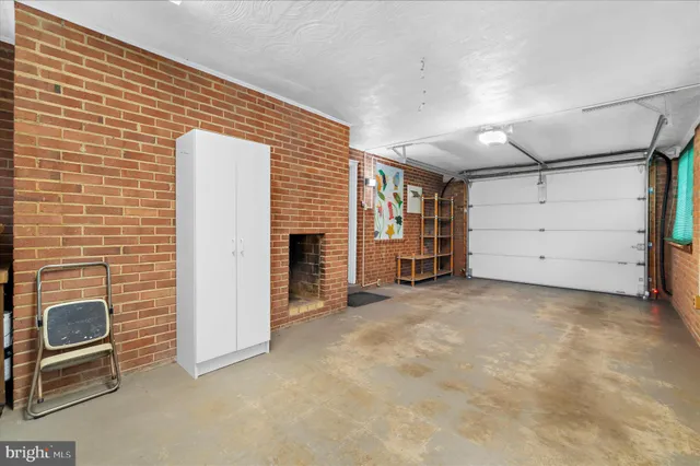 a view of a balcony with chairs and wooden floor