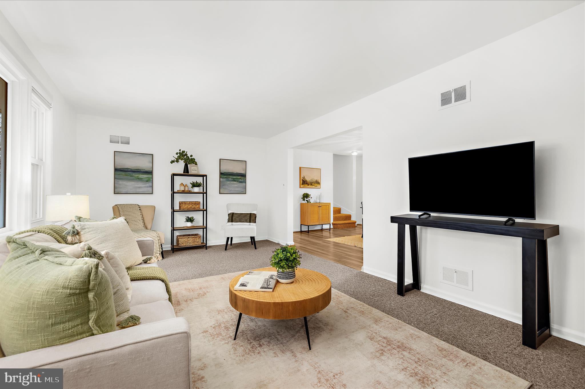 2930 Powder Mill Road Hyattsville, MD 20783 - Photo 6 of 53 a living room with furniture and a flat screen tv