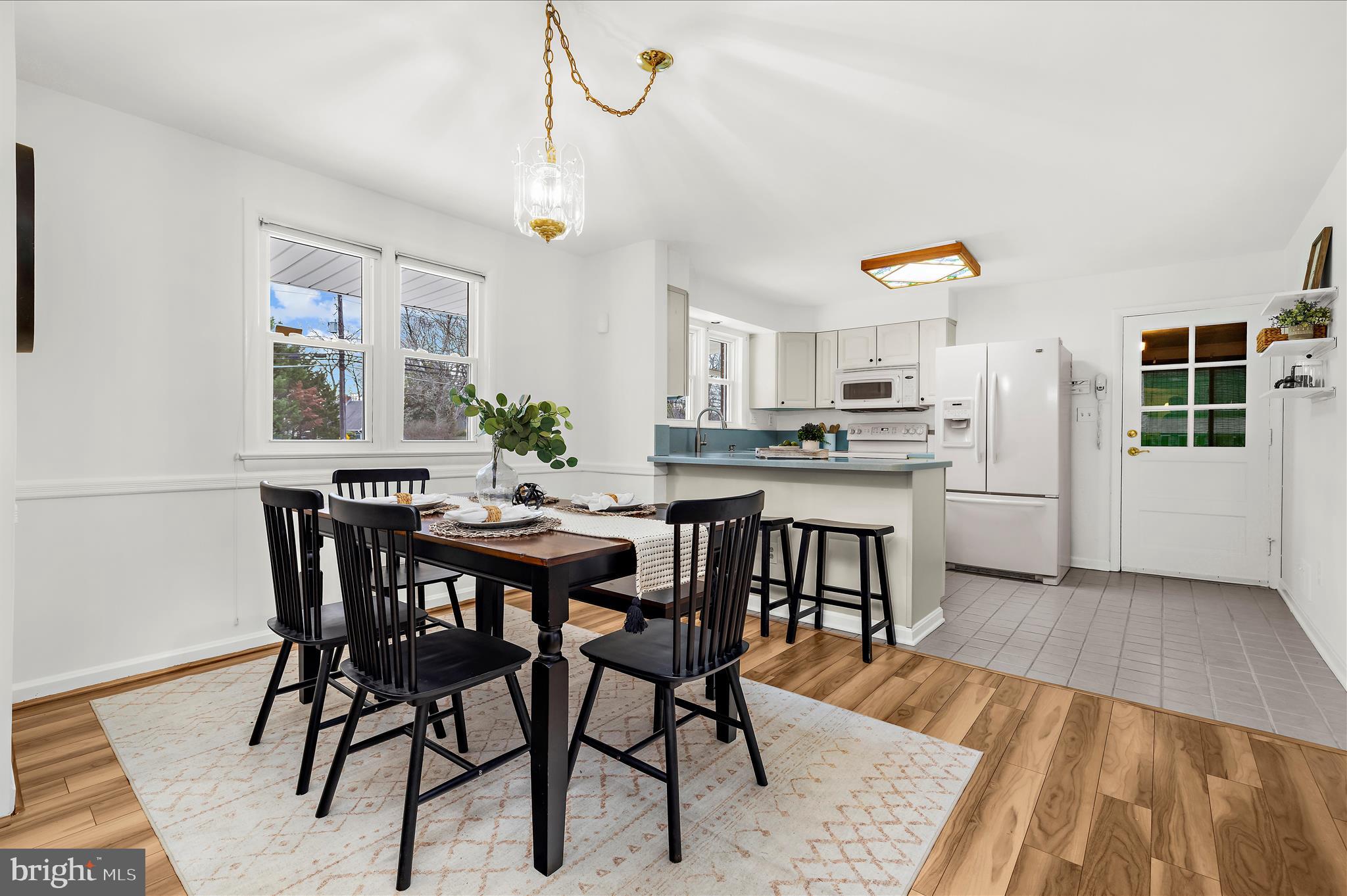 2930 Powder Mill Road Hyattsville, MD 20783 - Photo 8 of 53 a view of a dining room with furniture and wooden floor