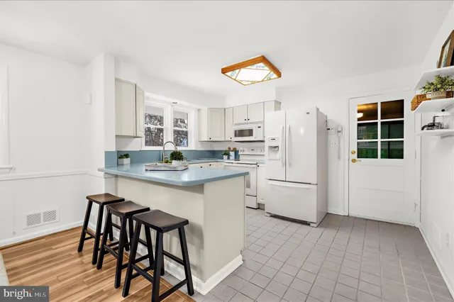 a kitchen with a sink cabinets and window