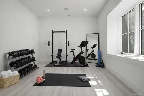 a room with gym equipment and a mirror