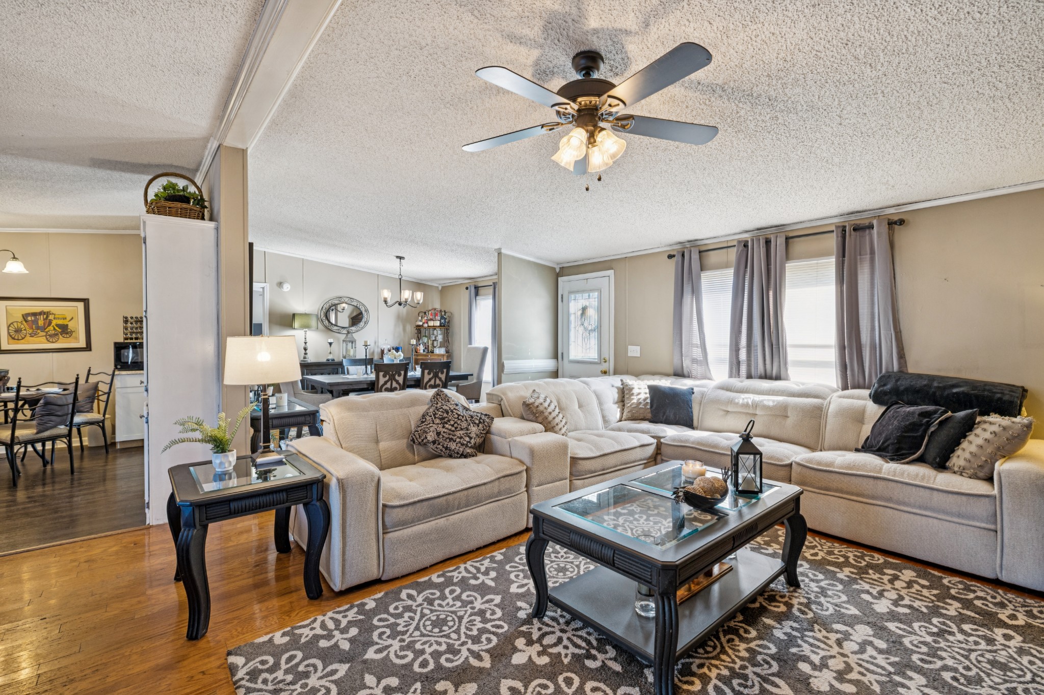 257 Bunker Hill Road Rockvale, TN 37153 - Photo 11 of 38 a living room with furniture a rug and a chandelier