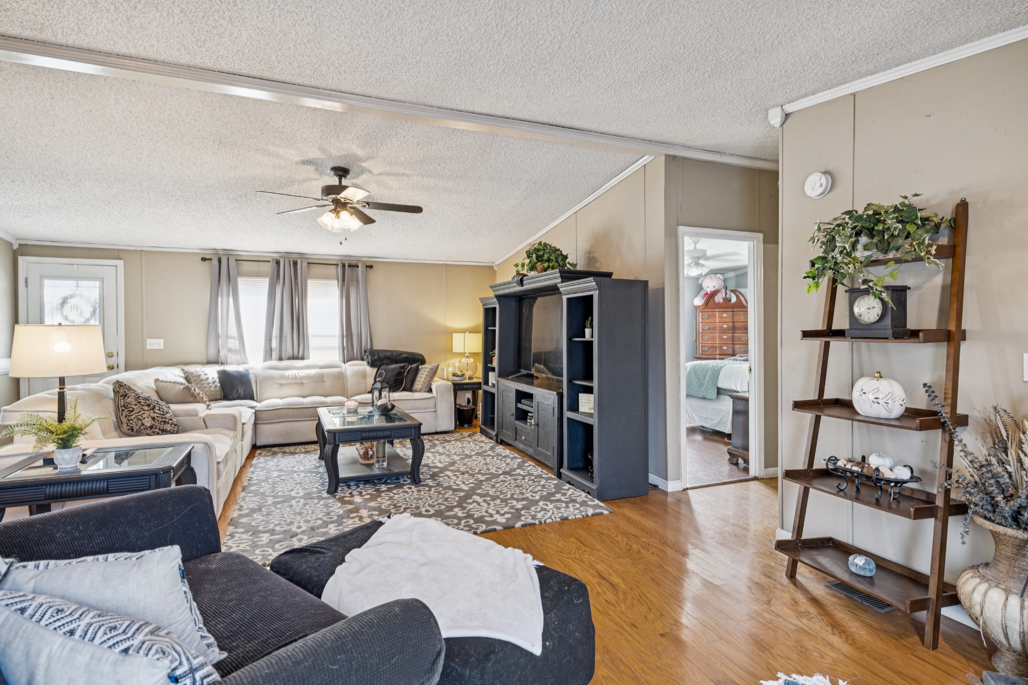 257 Bunker Hill Road Rockvale, TN 37153 - Photo 16 of 38 a living room with furniture and a flat screen tv