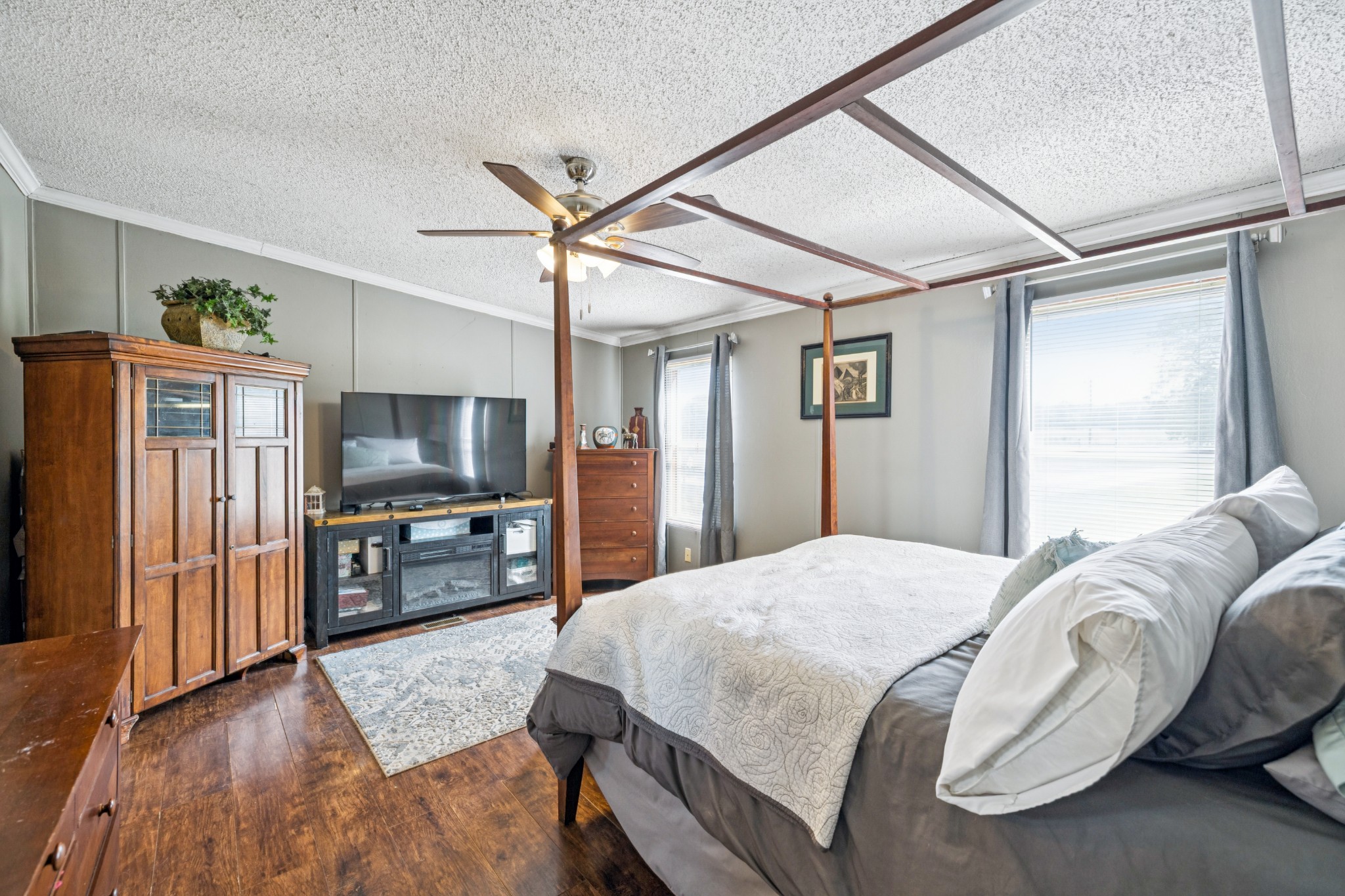 257 Bunker Hill Road Rockvale, TN 37153 - Photo 20 of 38 a spacious bedroom with a bed and a flat screen tv