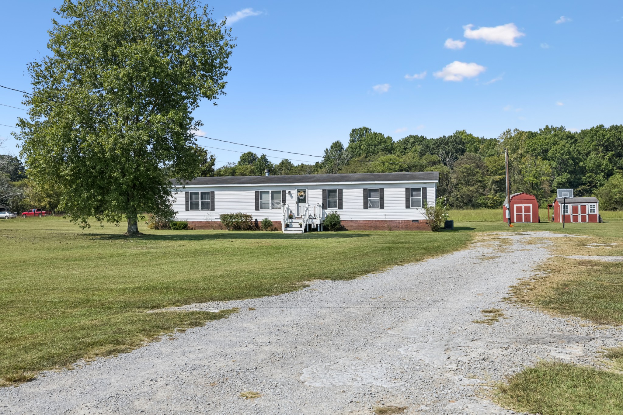 257 Bunker Hill Road Rockvale, TN 37153 - Photo 2 of 38 a front view of a house with a garden