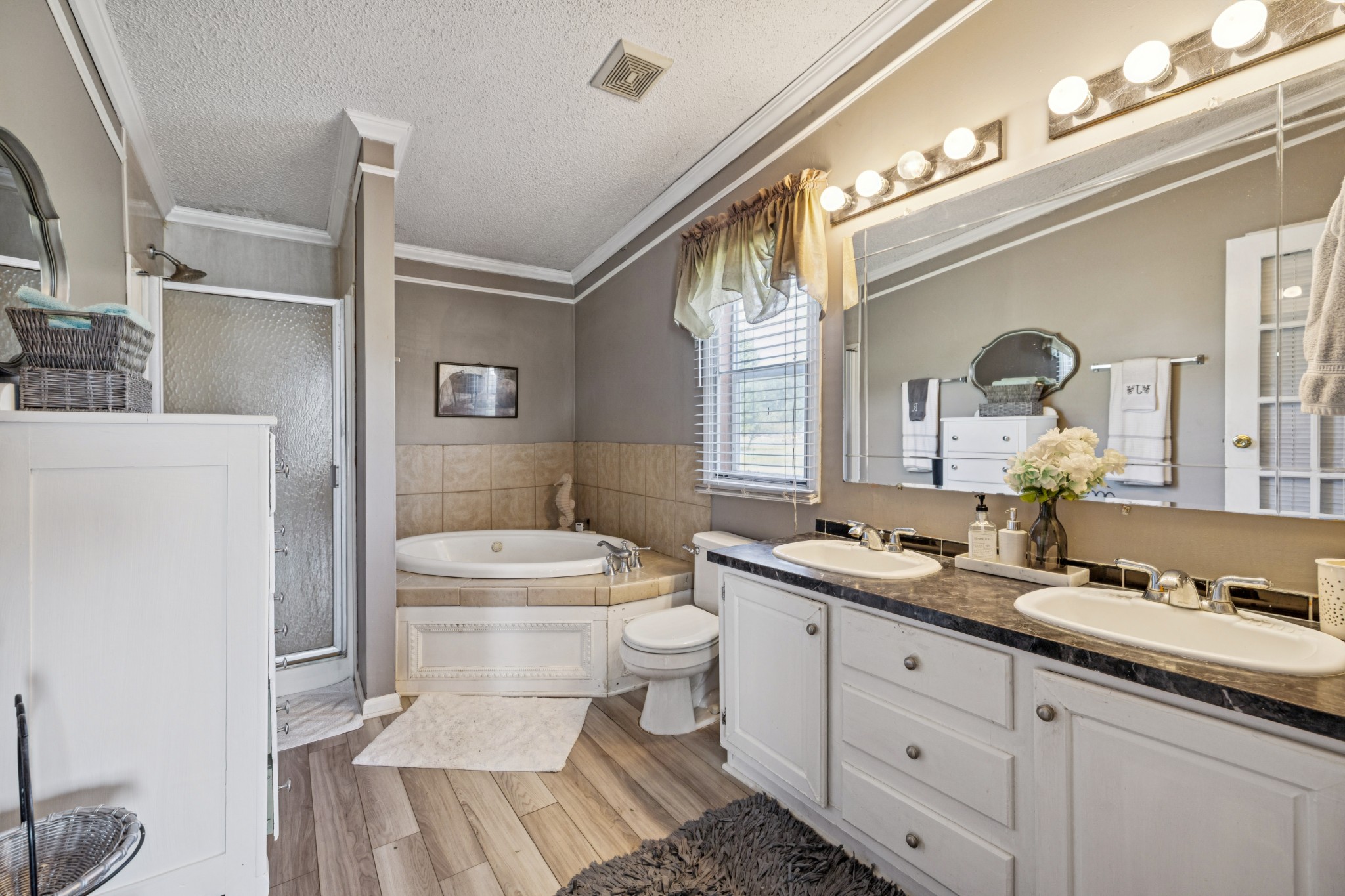 257 Bunker Hill Road Rockvale, TN 37153 - Photo 22 of 38 a bathroom with a double vanity sink mirror and toilet