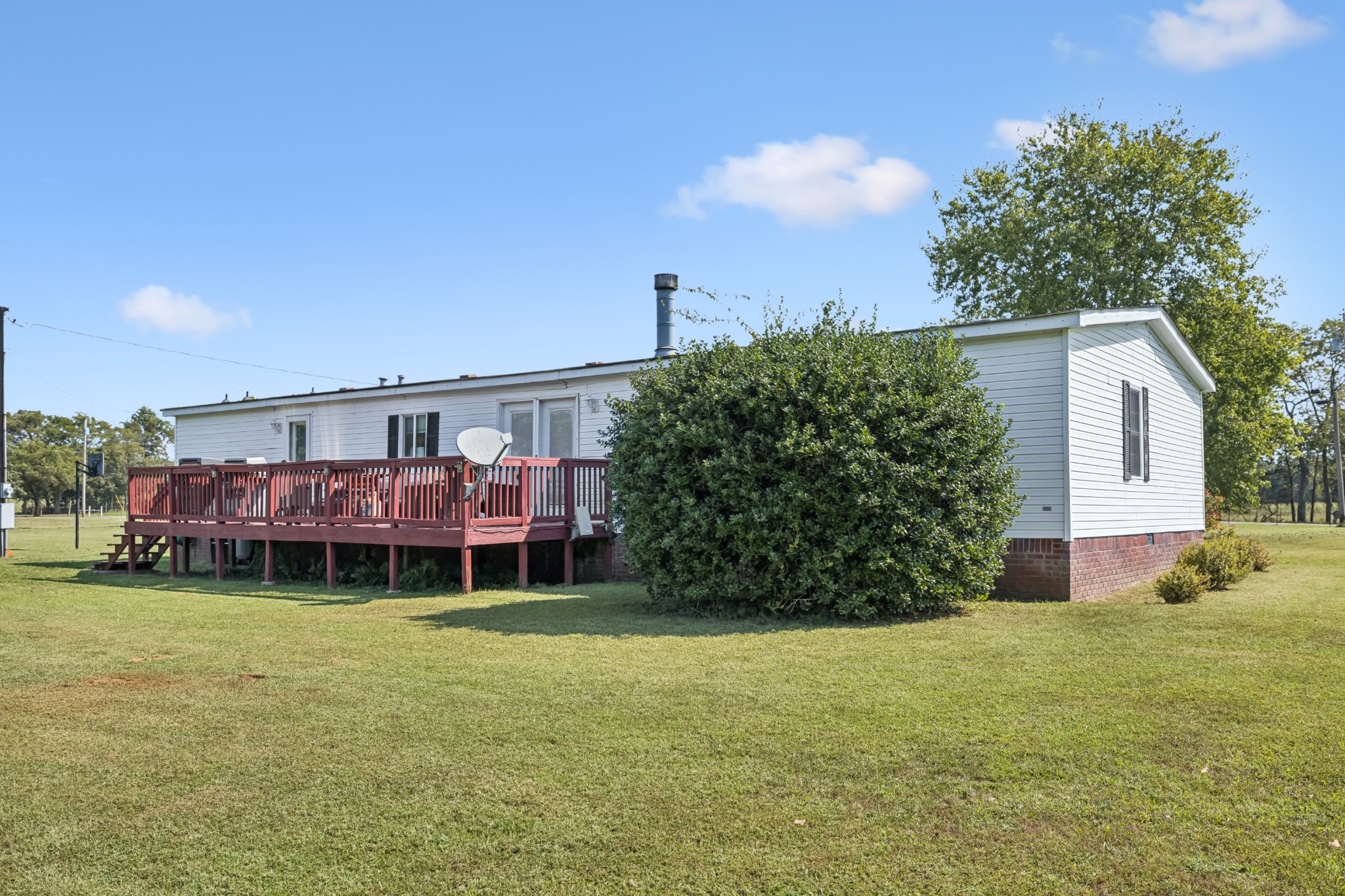 257 Bunker Hill Road Rockvale, TN 37153 - Photo 29 of 38 a view of a house with a yard and sitting area