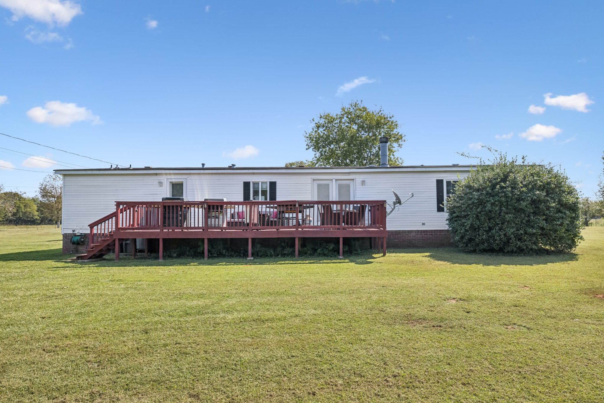 257 Bunker Hill Road Rockvale, TN 37153 - Photo 30 of 38 a view of a house with yard and sitting area