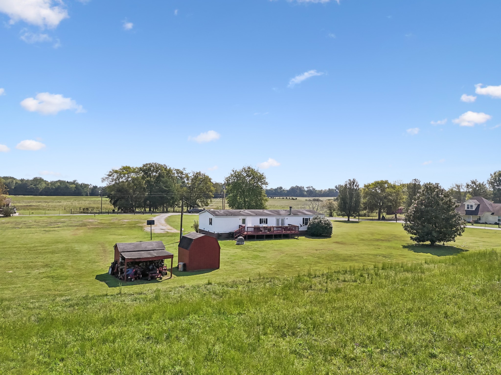 257 Bunker Hill Road Rockvale, TN 37153 - Photo 38 of 38 a view of a lake with lawn chairs and a table