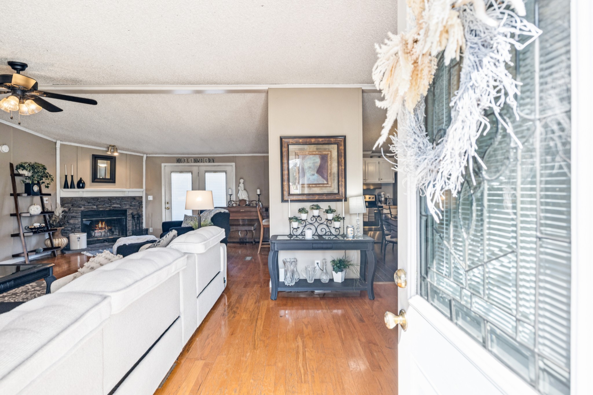 257 Bunker Hill Road Rockvale, TN 37153 - Photo 7 of 38 a living room with furniture a fireplace and a large window