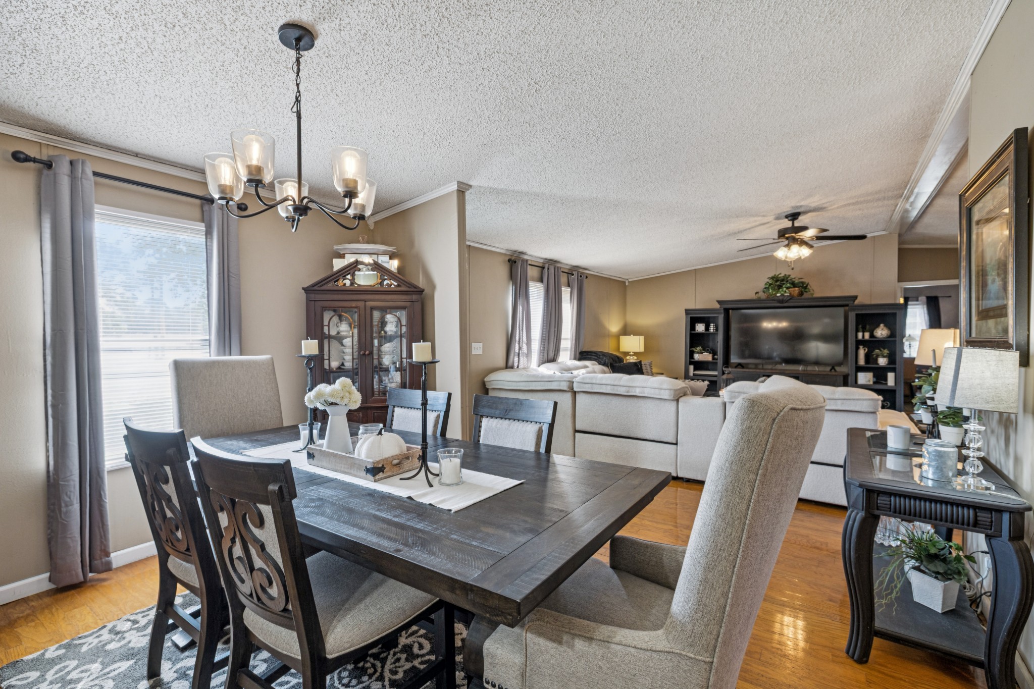 257 Bunker Hill Road Rockvale, TN 37153 - Photo 9 of 38 a view of a dining room with furniture a chandelier and wooden floor