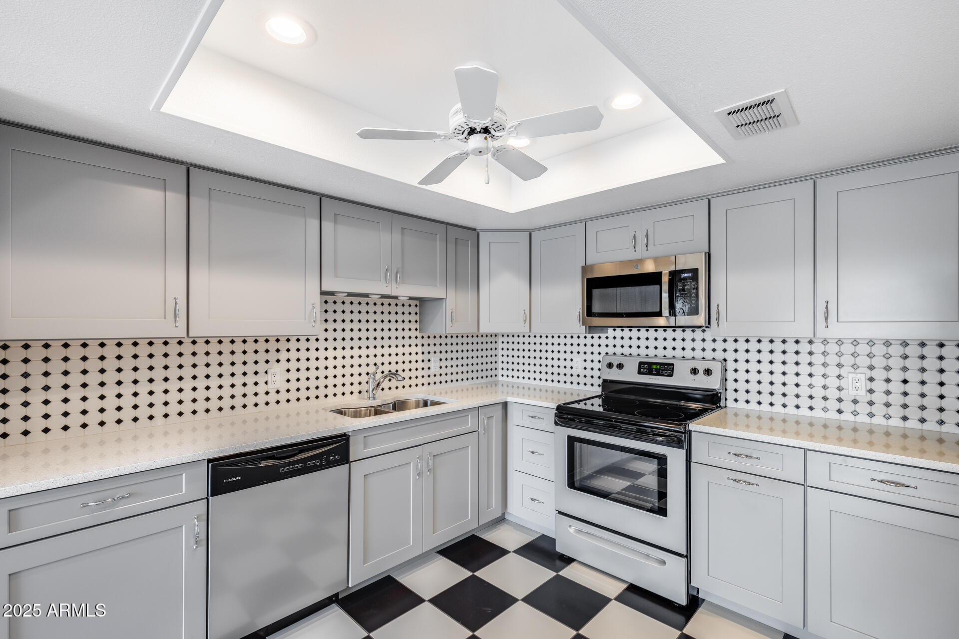 7820 East Camelback Road, Unit 211 Scottsdale, AZ 85251 - Photo 23 of 52 a kitchen with white cabinets appliances and a sink