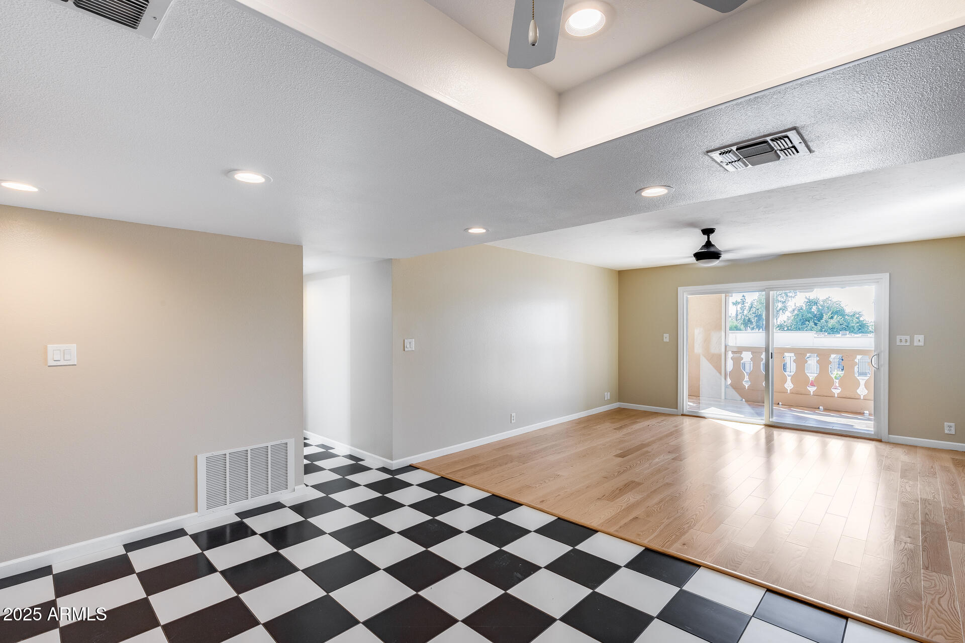 7820 East Camelback Road, Unit 211 Scottsdale, AZ 85251 - Photo 24 of 52 a view of an empty room with glass door and a window