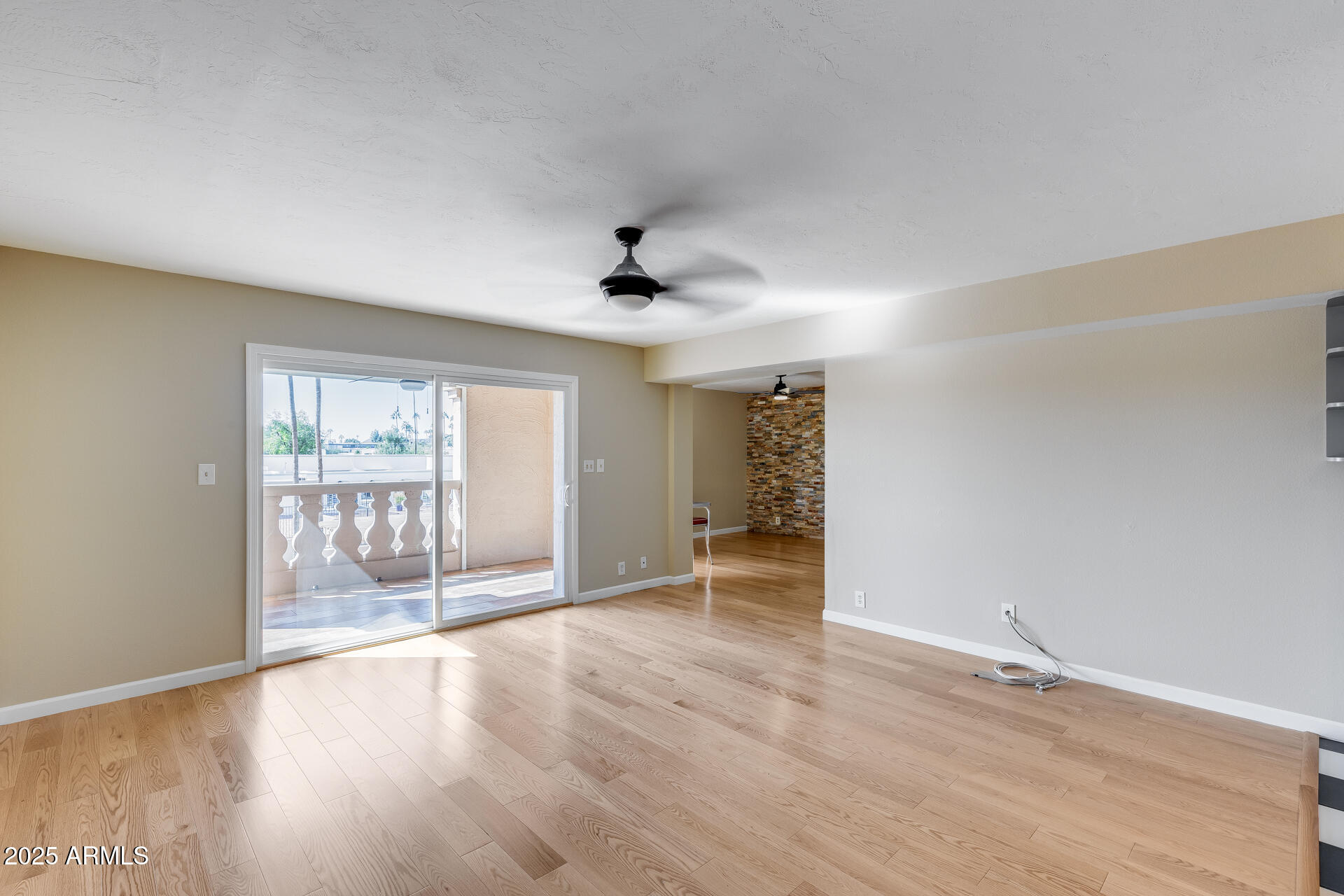 7820 East Camelback Road, Unit 211 Scottsdale, AZ 85251 - Photo 28 of 52 wooden floor in an empty room with a window