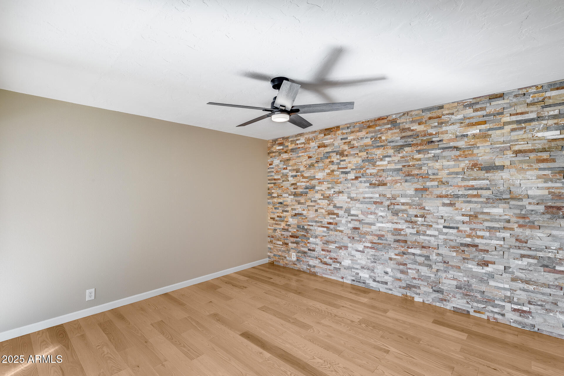 7820 East Camelback Road, Unit 211 Scottsdale, AZ 85251 - Photo 29 of 52 a view of empty room with wooden floor