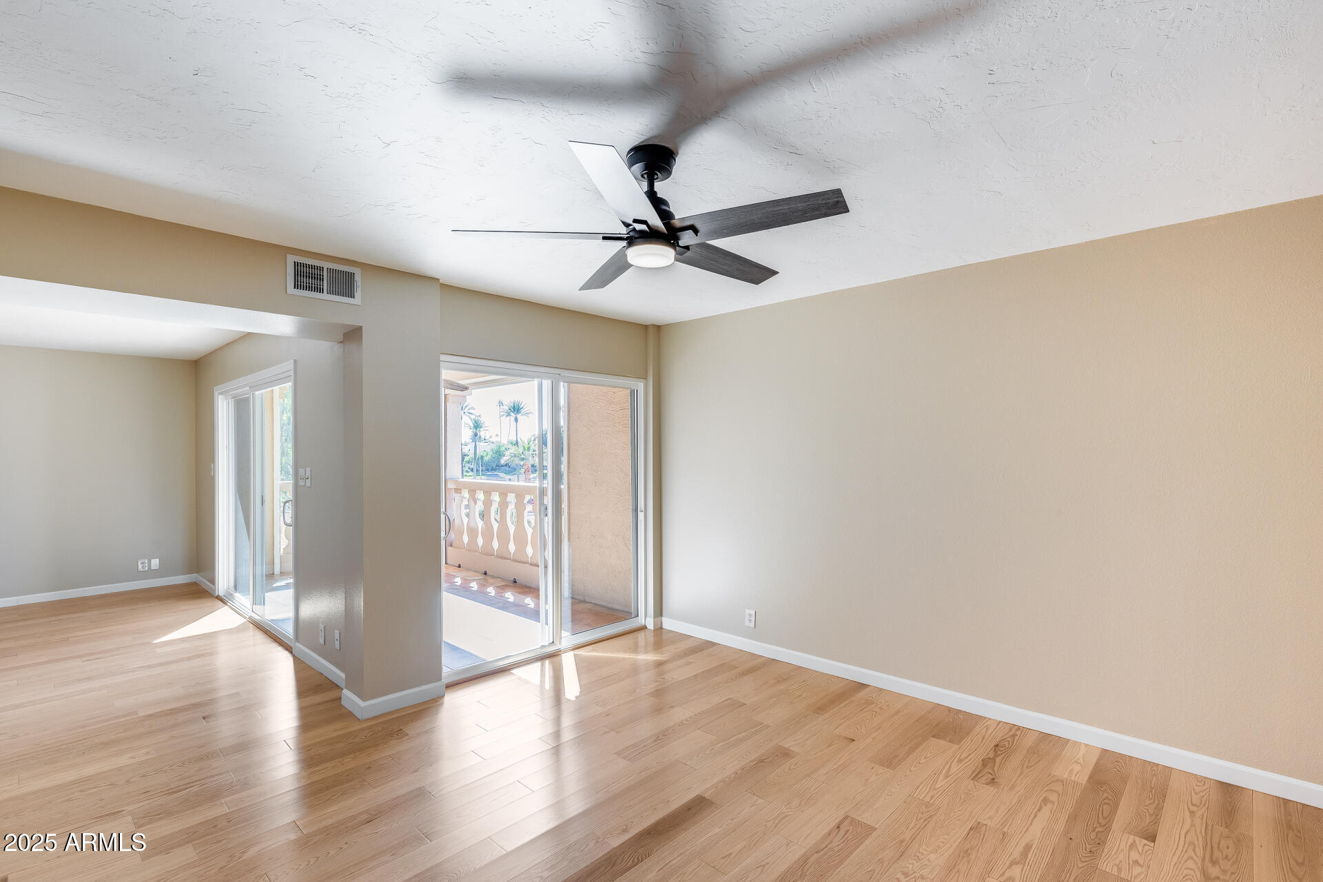 7820 East Camelback Road, Unit 211 Scottsdale, AZ 85251 - Photo 30 of 52 wooden floor in an empty room with a window