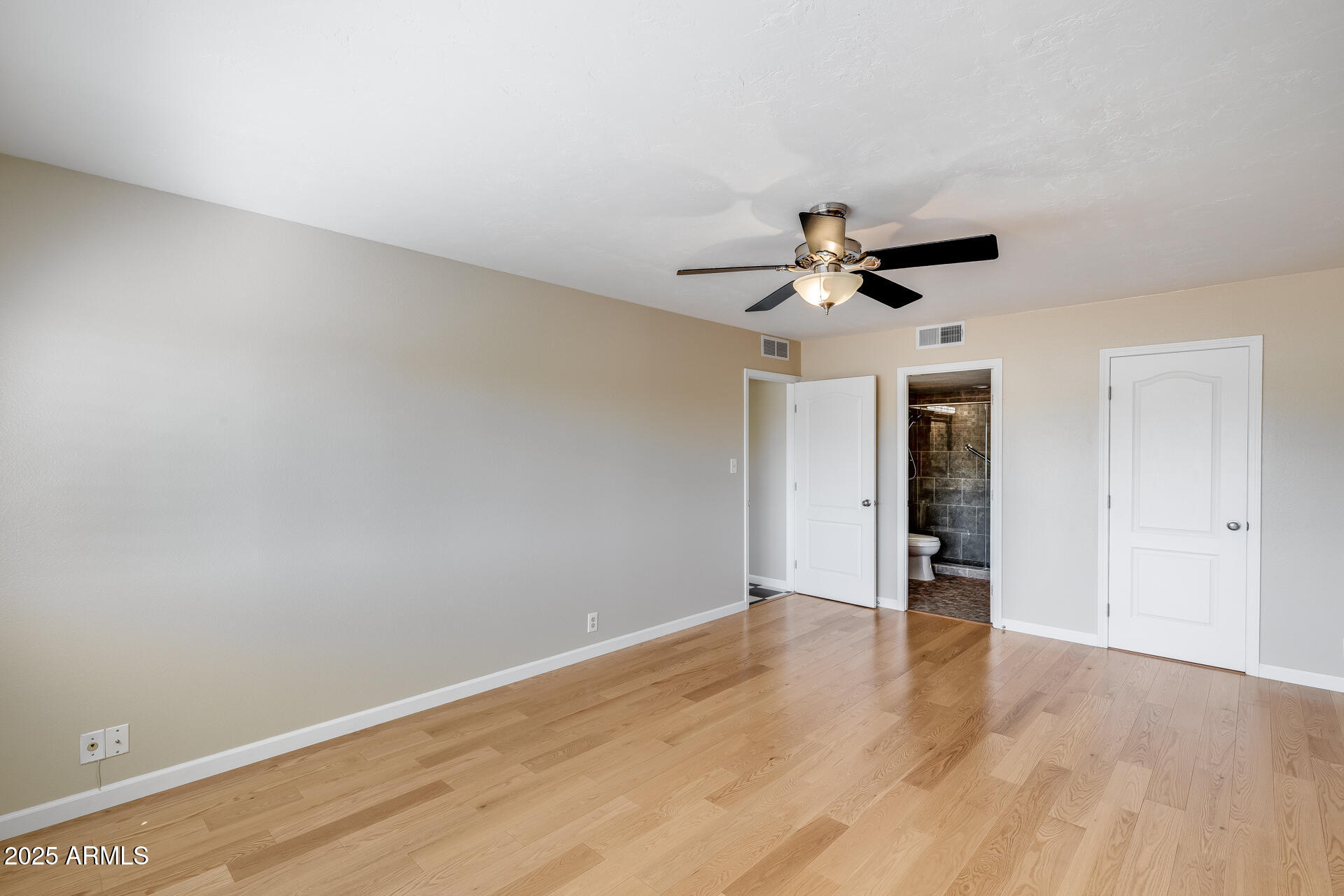 7820 East Camelback Road, Unit 211 Scottsdale, AZ 85251 - Photo 37 of 52 a view of an empty room with a ceiling fan