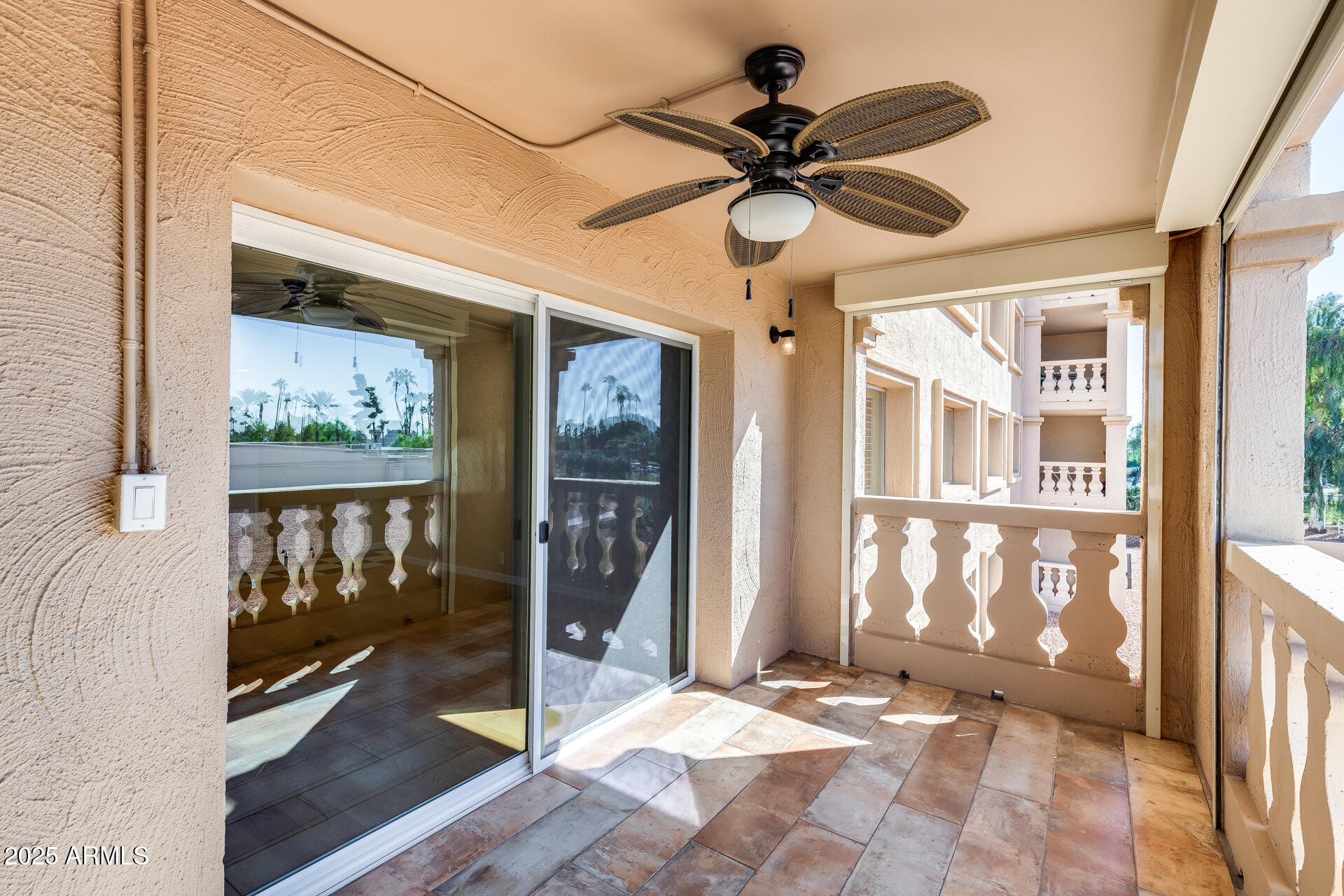 7820 East Camelback Road, Unit 211 Scottsdale, AZ 85251 - Photo 43 of 52 a view of a livingroom with a ceiling fan and window