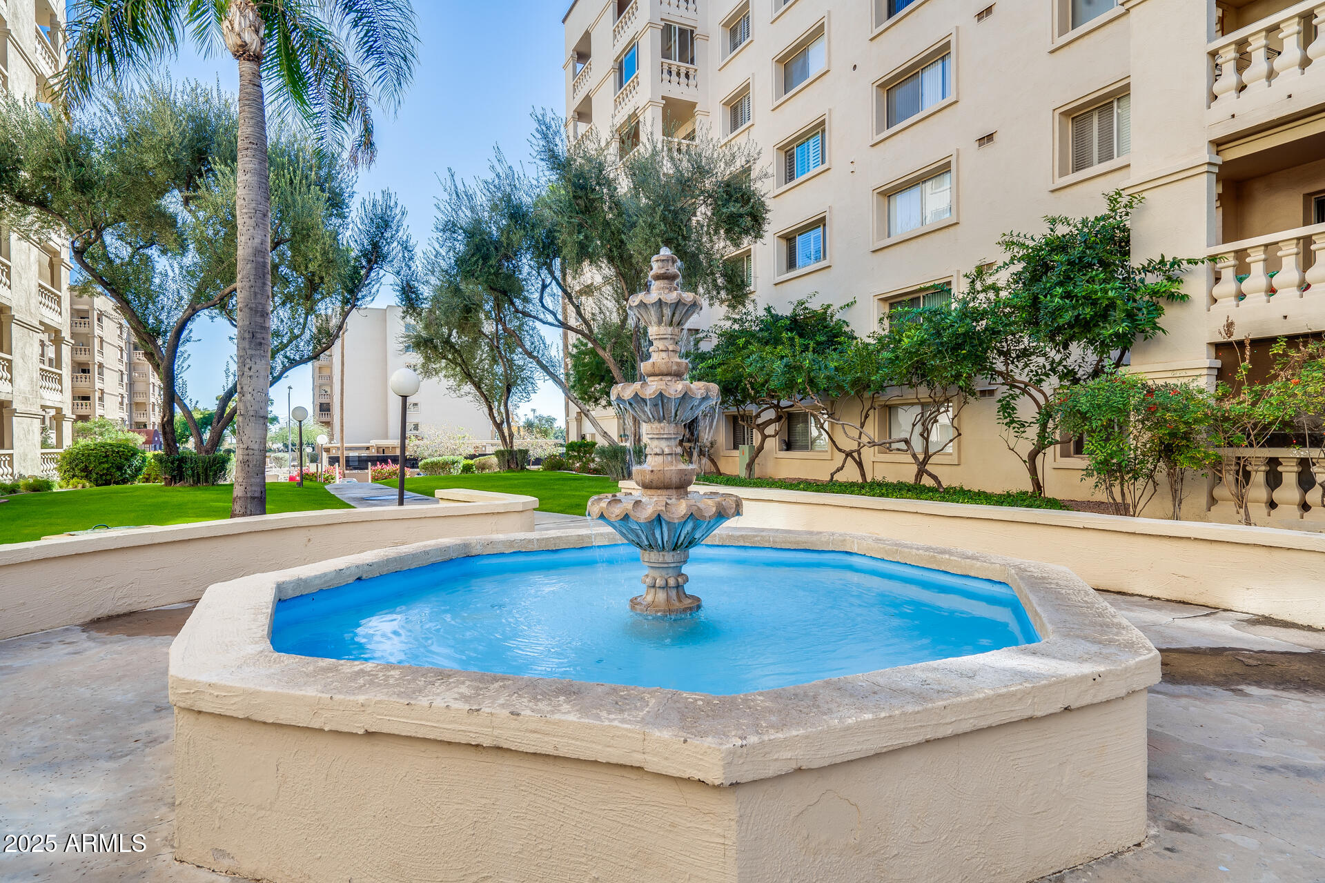7820 East Camelback Road, Unit 211 Scottsdale, AZ 85251 - Photo 49 of 52 a swimming pool with yard and outdoor seating