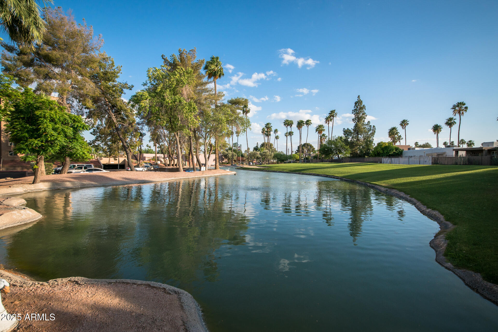 7820 East Camelback Road, Unit 211 Scottsdale, AZ 85251 - Photo 51 of 52 a view of a lake with houses