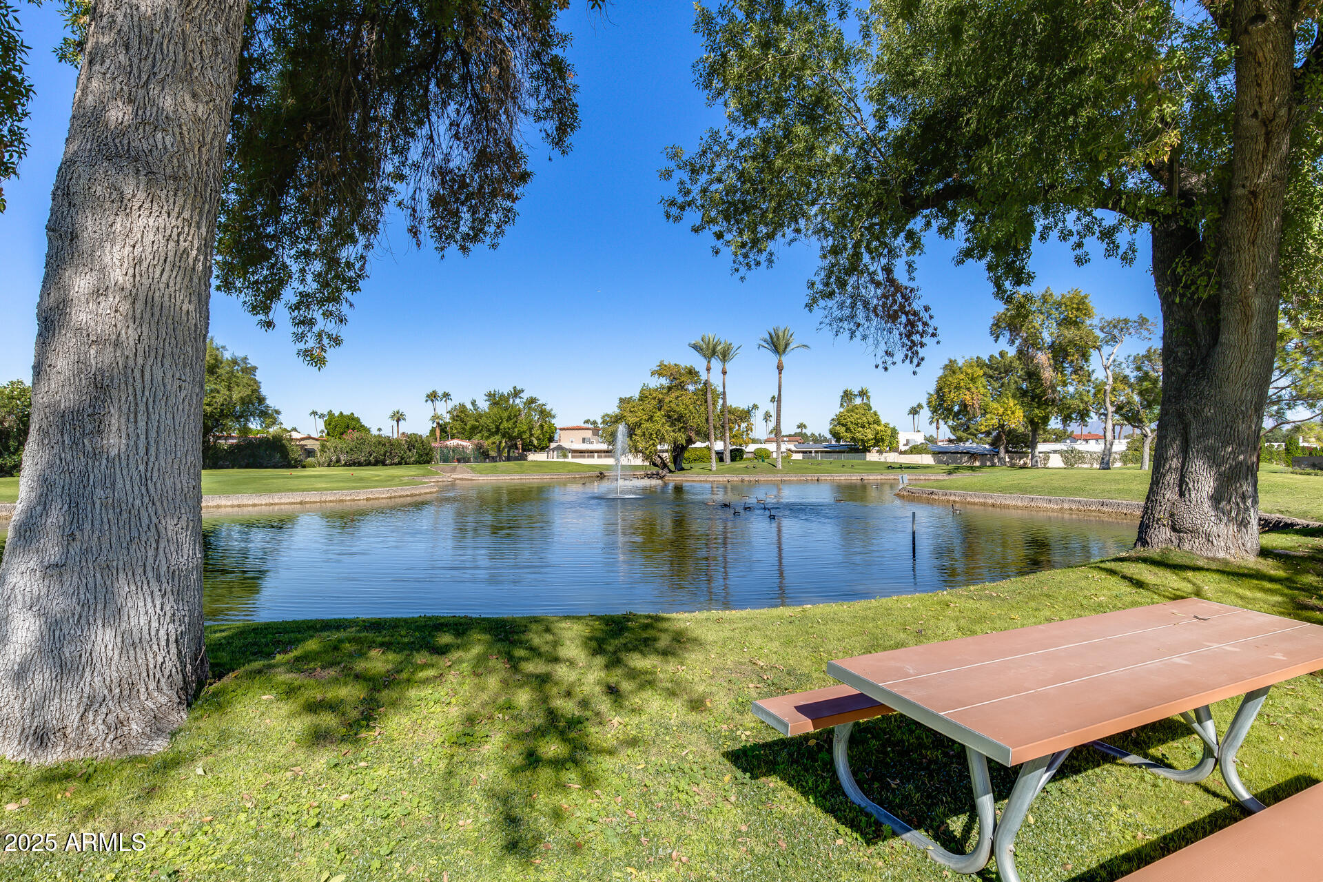 7820 East Camelback Road, Unit 211 Scottsdale, AZ 85251 - Photo 7 of 52 a view of a lake with an outdoor space