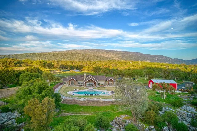 a front view of houses with a yard