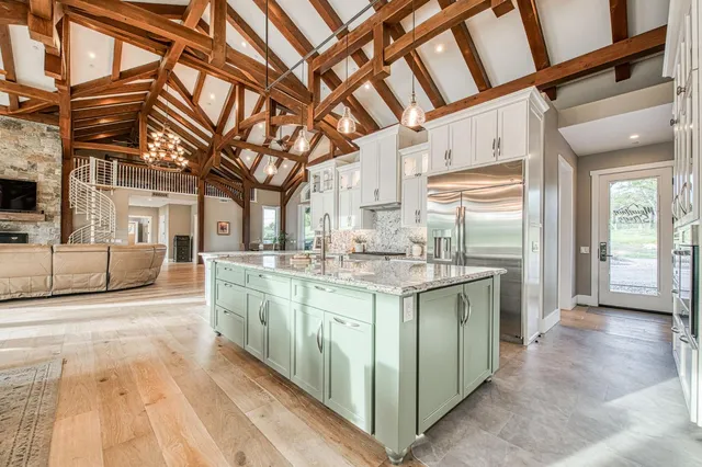 a kitchen with kitchen island granite countertop lots of counter top space