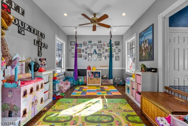 a bed room with furniture and a flat screen tv