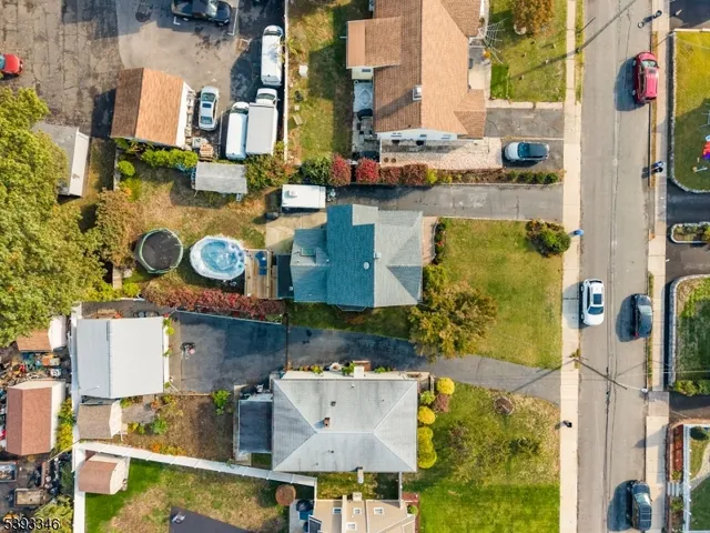 an aerial view of residential house with outdoor space and parking