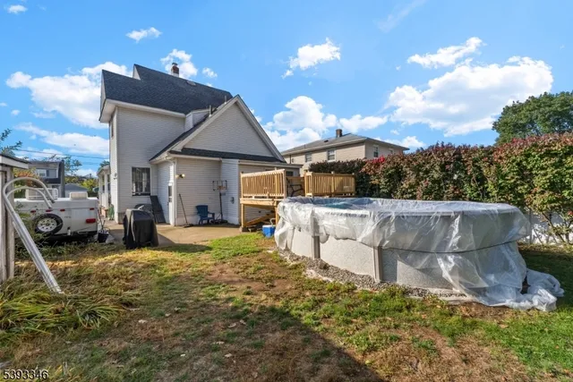 a view of a balcony with yard
