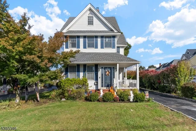 a view of a livingroom with furniture and staircase