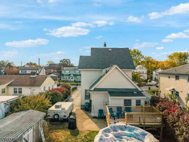 a aerial view of a house next to a yard