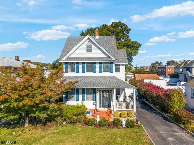 a front view of a house with a yard table and chairs