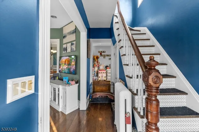 a view of an entryway with wooden floor
