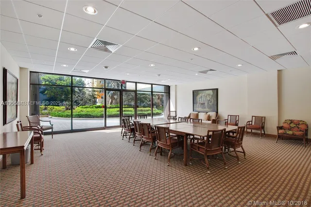 a room with pool table and flat screen tv