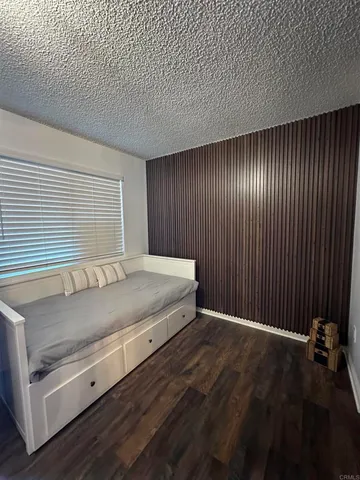 a front view of a house with a garden and plants