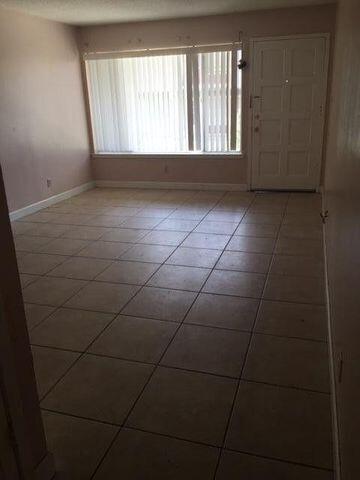 210 Pelham Road, Unit 107A Fort Walton Beach, FL 32547 - Photo 2 of 6 a view of an empty room with a window