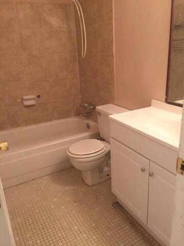 210 Pelham Road, Unit 107A Fort Walton Beach, FL 32547 - Photo 4 of 6 a bathroom with a toilet and a shower