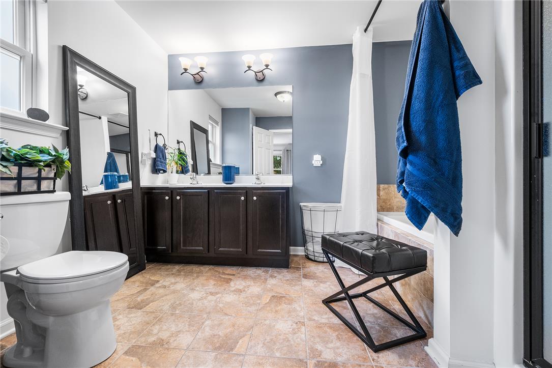 487 Long Run Road Drums, PA 18222 - Photo 25 of 35 A spacious double vanity and tile flooring highlight this bright primary bathroom.