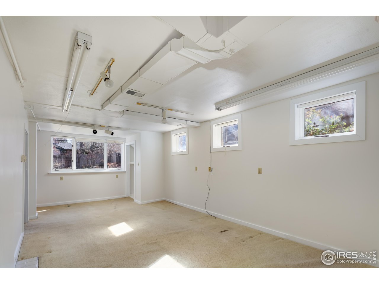 842 Grant Place Boulder, CO 80302 - Photo 25 of 40 a view of a big room with paintings on the wall