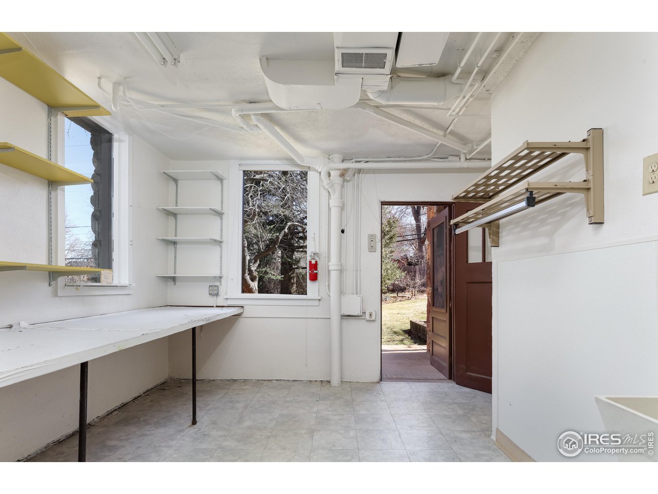 842 Grant Place Boulder, CO 80302 - Photo 28 of 40 a room with cabinets and window