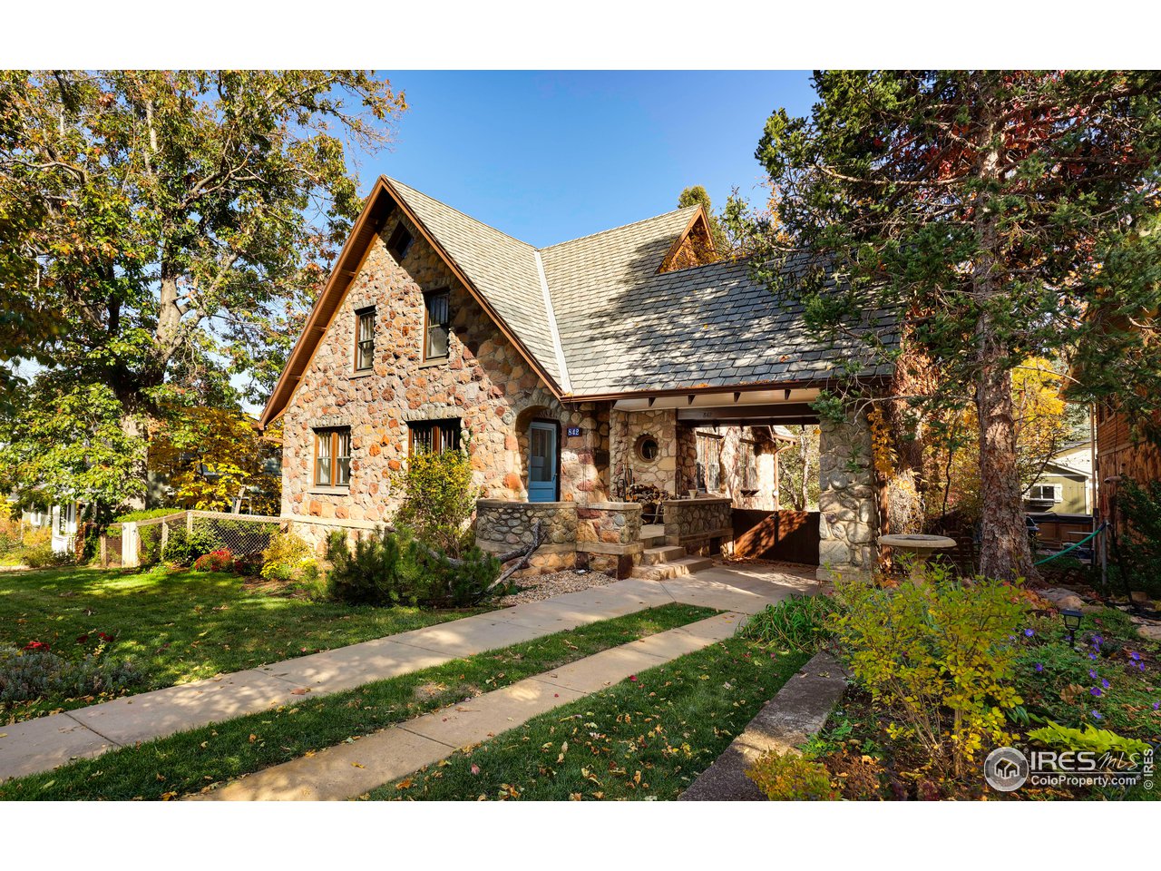 842 Grant Place Boulder, CO 80302 - Photo 3 of 40 a view of a house with backyard sitting area and garden