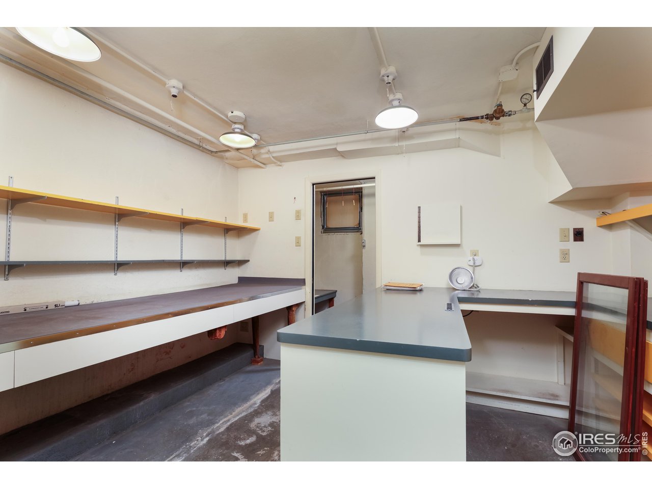 842 Grant Place Boulder, CO 80302 - Photo 31 of 40 a kitchen with stainless steel appliances wooden cabinets and view of living room