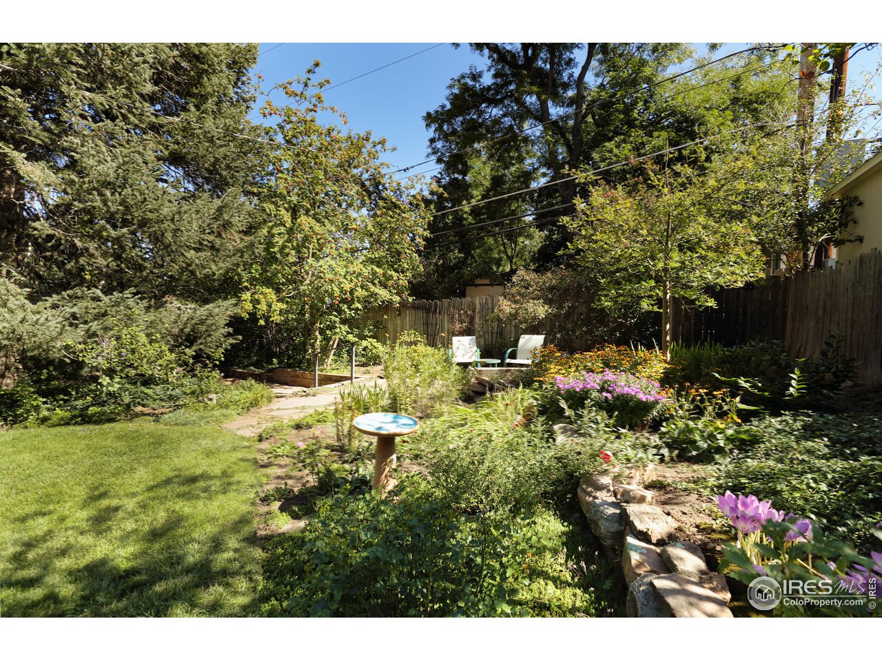 842 Grant Place Boulder, CO 80302 - Photo 34 of 40 a view of a house with a yard
