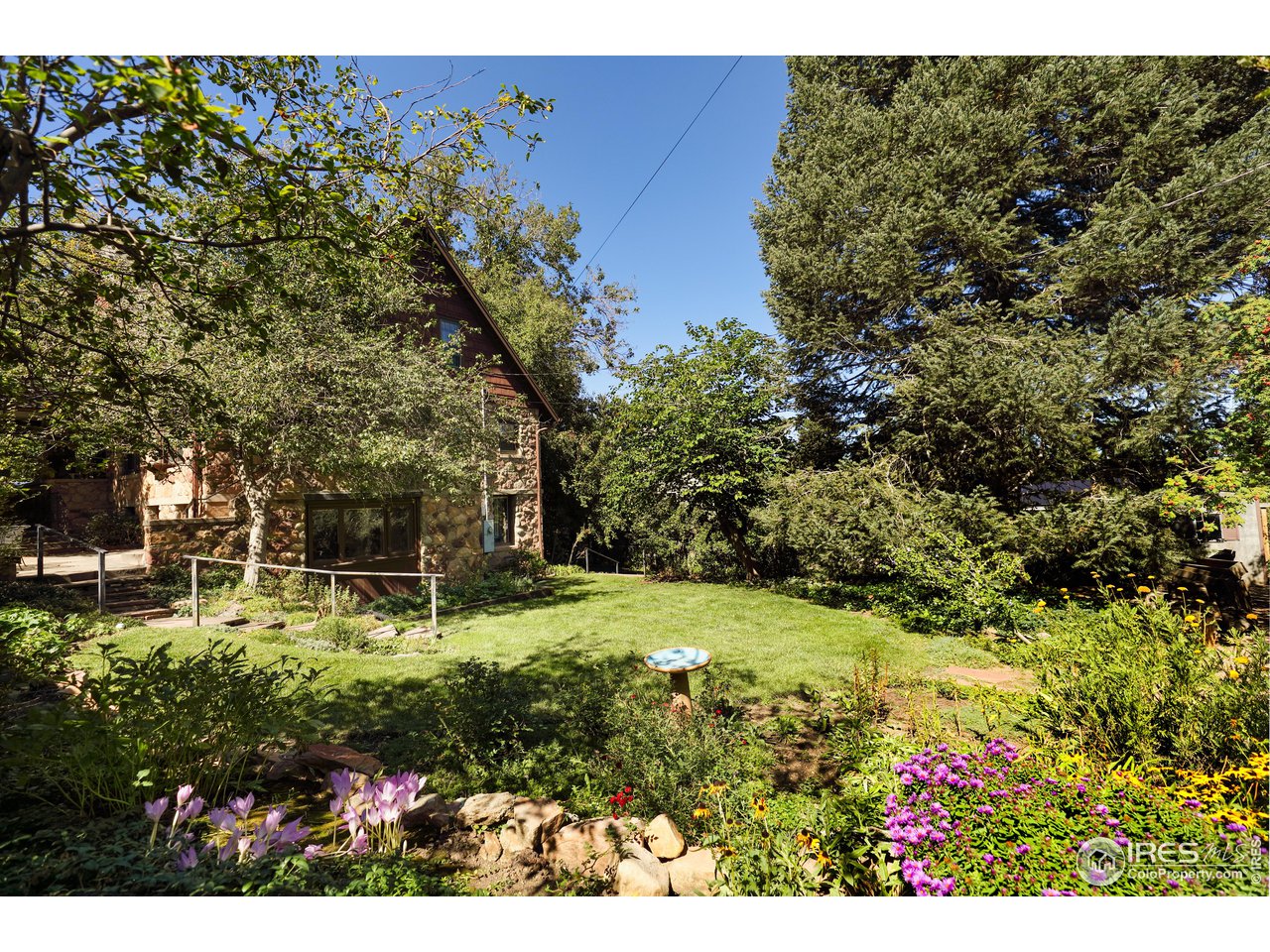 842 Grant Place Boulder, CO 80302 - Photo 37 of 40 a view of a backyard with table and chairs and potted plants