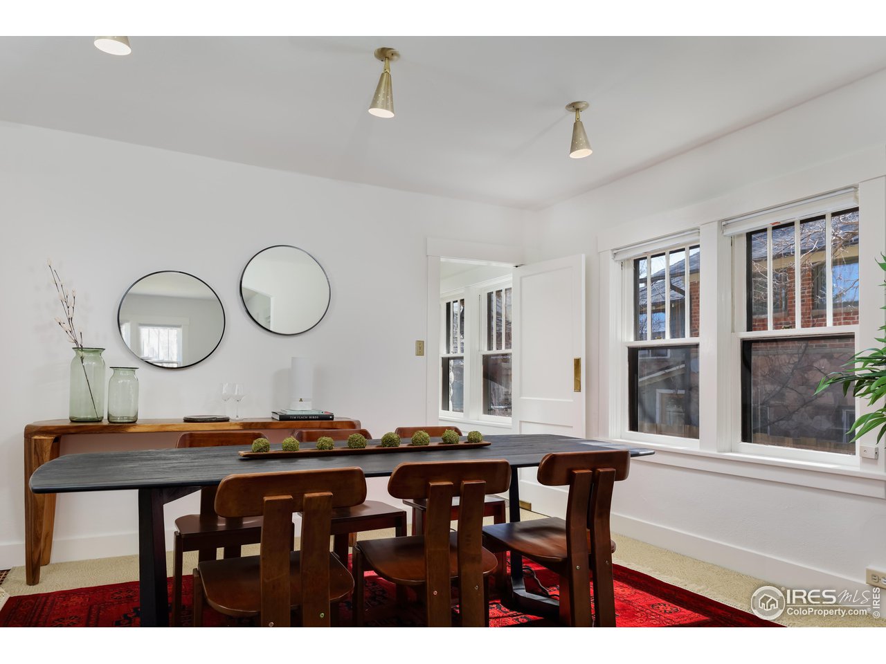 842 Grant Place Boulder, CO 80302 - Photo 10 of 40 a living room with wooden floor and furniture