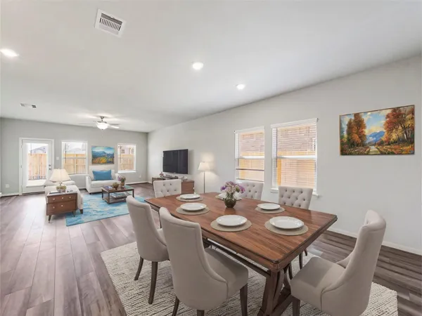 a view of a dining room with furniture window and wooden floor