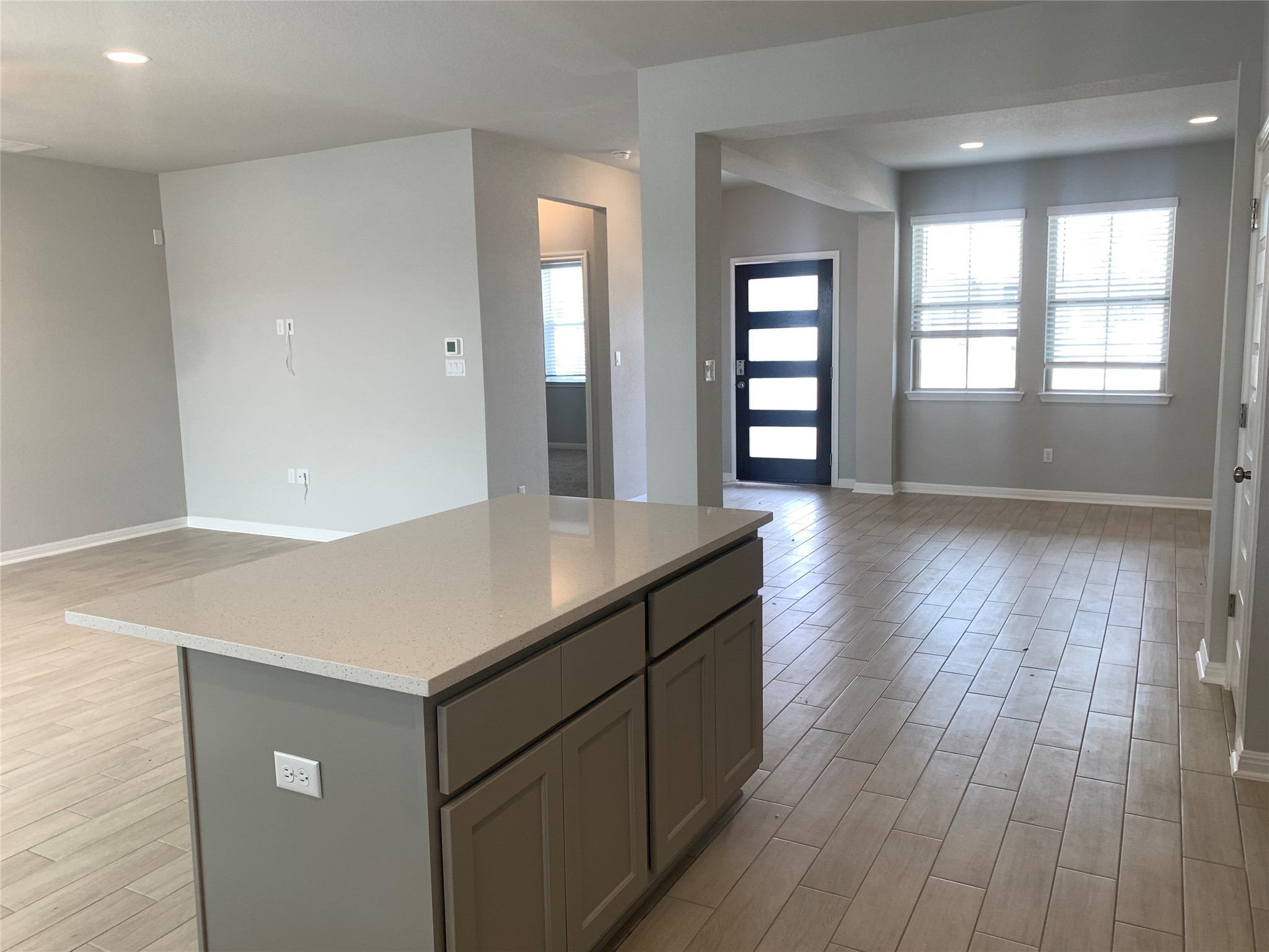 2948 Sage Ranch Drive Leander, TX 78641 - Photo 6 of 28 An inviting open-concept layout features a well-appointed kitchen island and abundant natural light.