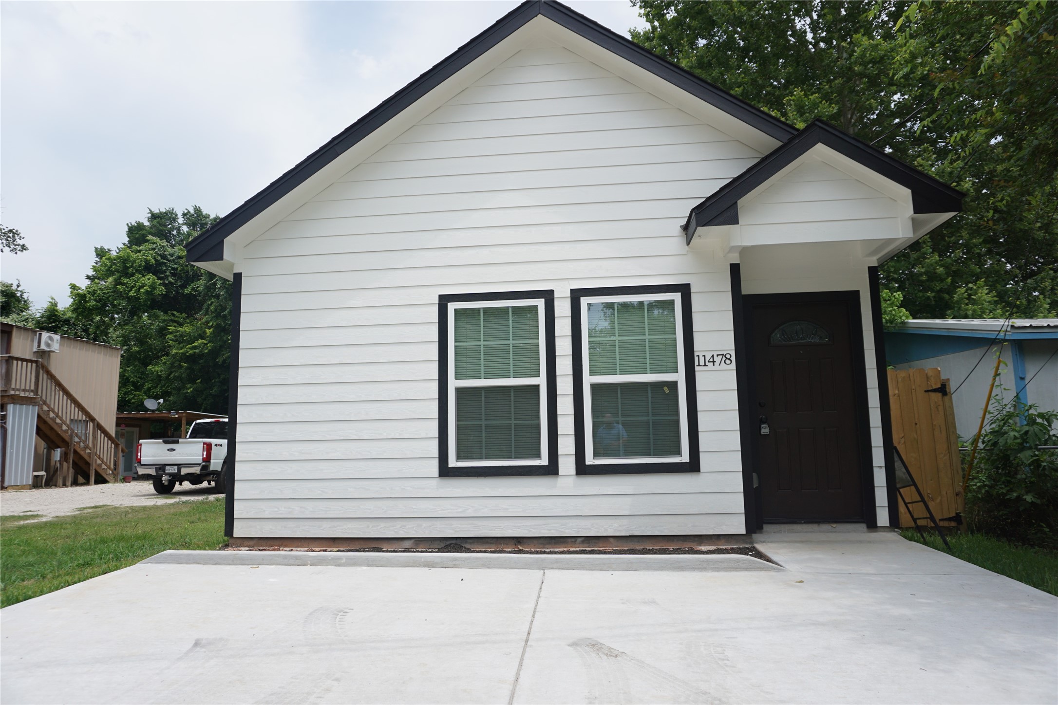 a view of a house with a garden and pathway