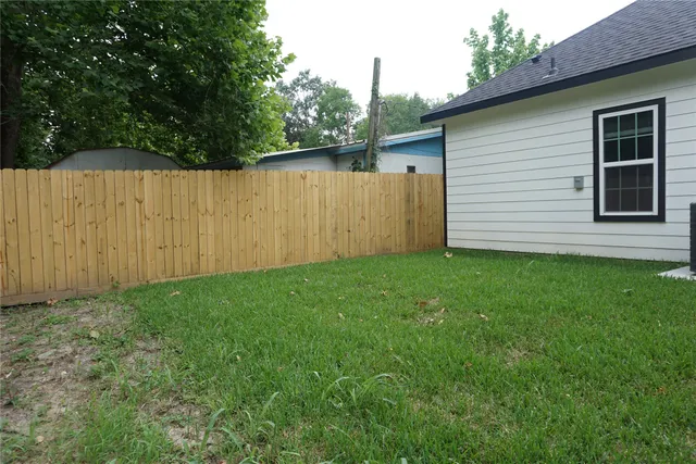 a backyard of a house with lots of green space